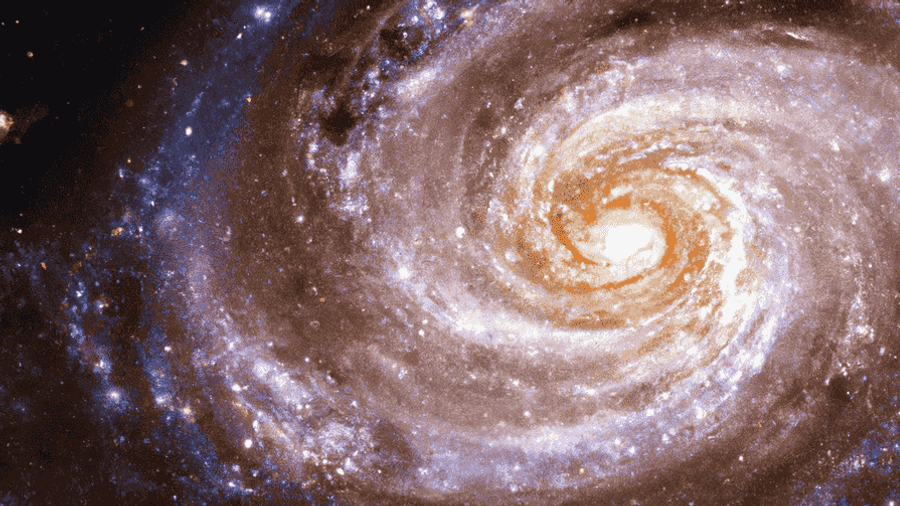 An image of a stunning spiral galaxy, shining bright against the backdrop of the cosmos.