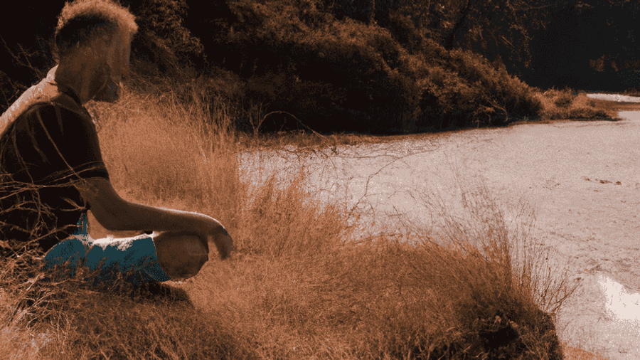 A peaceful image of a person meditating in a serene natural setting.